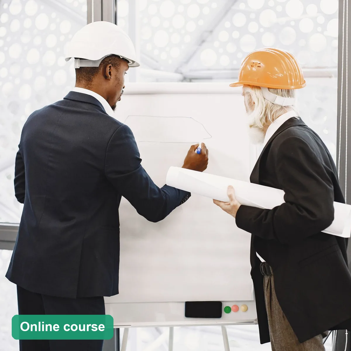 Two managers in hard hats discussing a plan at a whiteboard (online course)